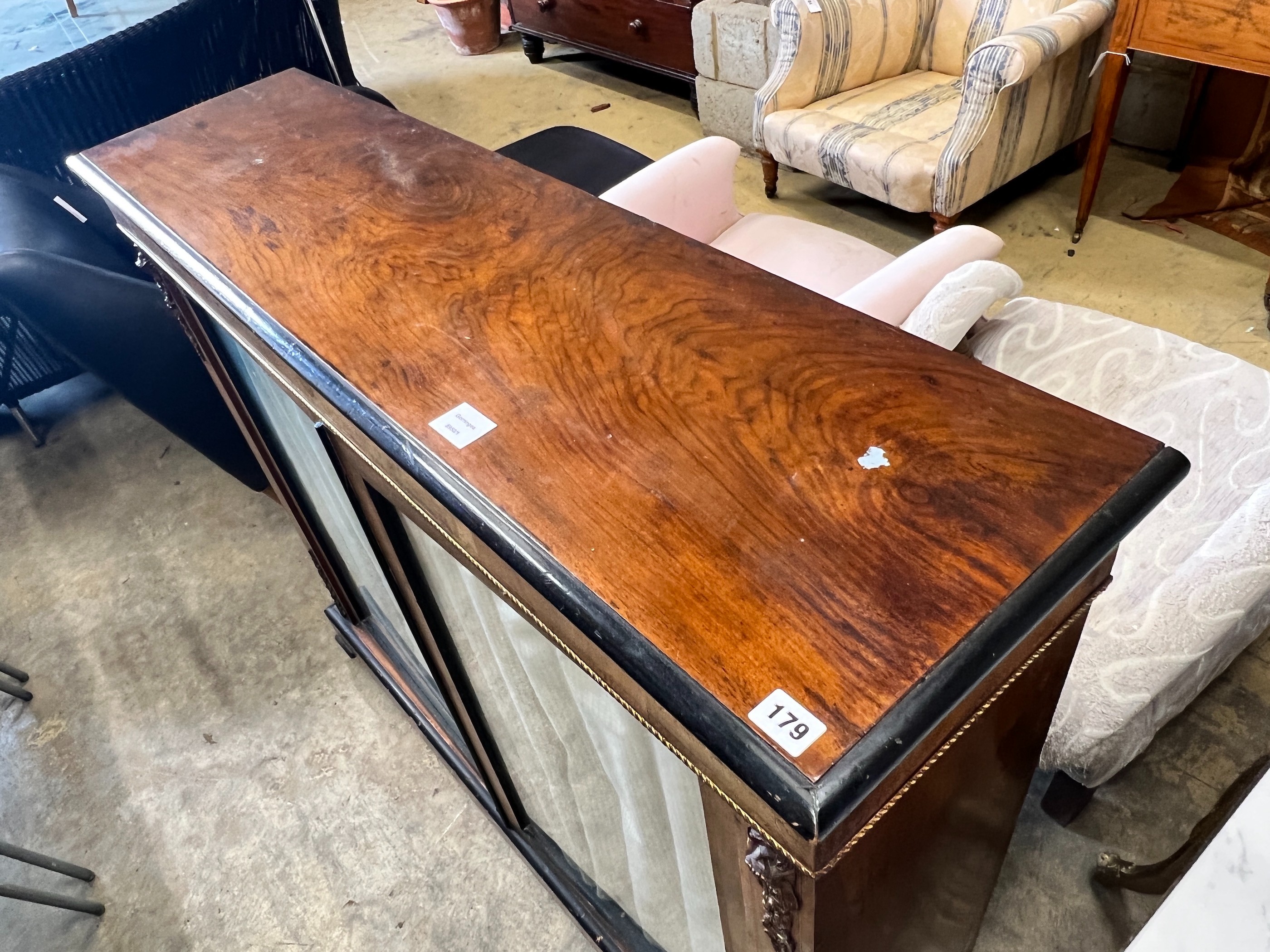 A Victorian gilt metal mounted inlaid walnut two door pier cabinet, width 121cm, depth 32cm, height 105cm